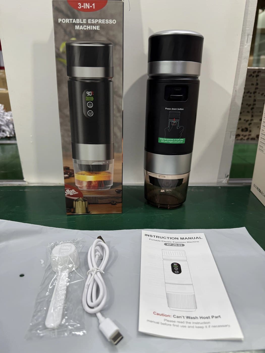 The 3-in-1 portable espresso machine we sourced and delivered, with its box, USB cable, scoop and manual
